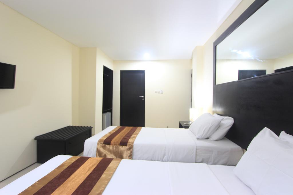 Airport Kuta Hotel And Residences Tuban Quarto foto